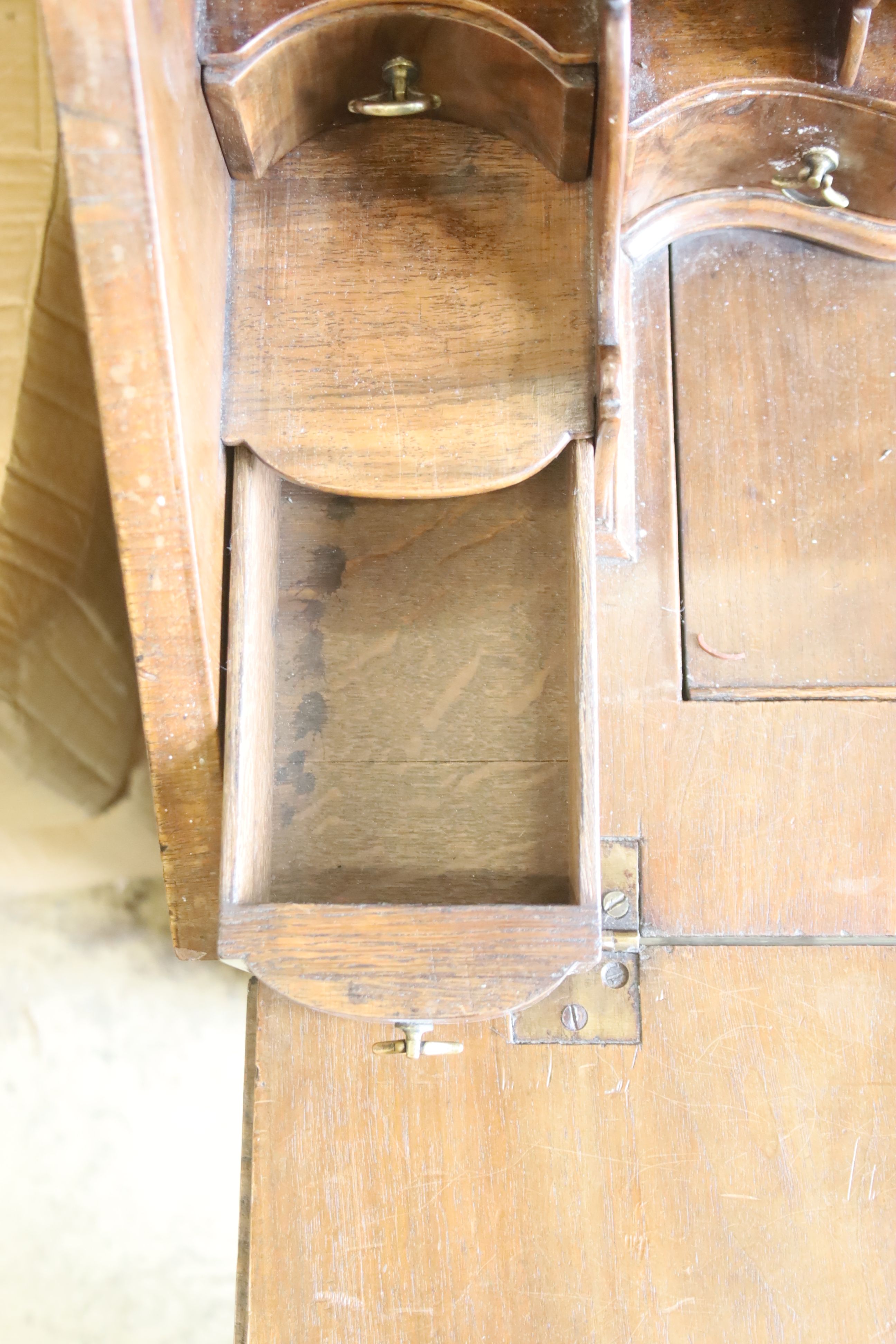 A Queen Anne style walnut double domed top bureau bookcase, length 72cm, width 50cm, height 196cm